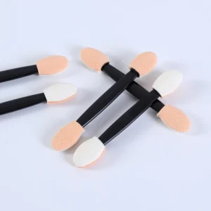 Nail blending sponges arranged in cross formation on white background