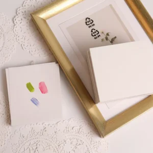 Nail polish blending sheets stacked with swatch sample and photo frame