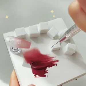 Nail polish dab tool in action blending polish on sponge cubes