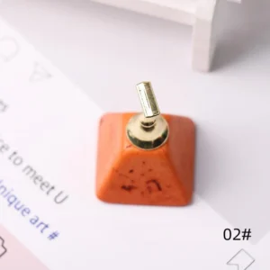 Orange turquoise stone nail stand with metallic tip holder