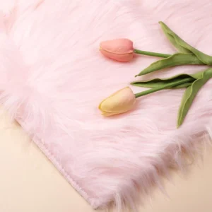 Pastel pink plush nail mat with soft texture and flower accents