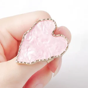 Pink heart-shaped wearable nail art palette ring with gold trim