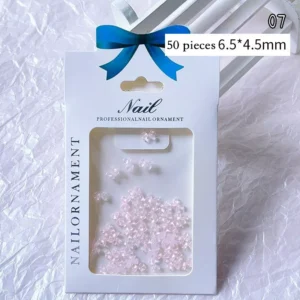 Light pink petal-shaped bow charms in resin for nails
