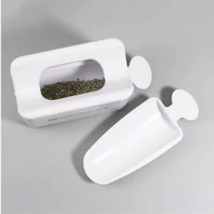 Top view of reusable nail glitter tray with separated scoop