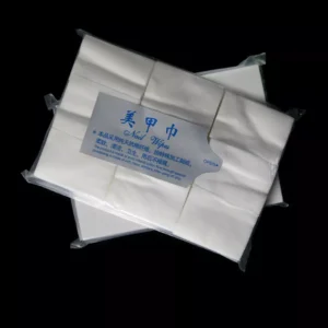 White lint-free nail wipes in minimalist packaging on black background