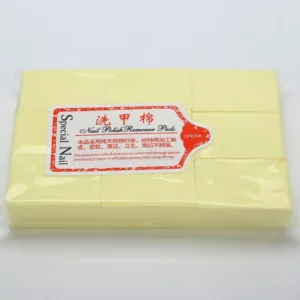 Yellow no-lint manicure pads packaged for nail care